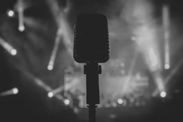 black and white, spotlight, microphone, concert, stage, gray microphone, gray concert, gray spotlight, spotlight, spotlight, spotlight, spotlight, spotlight, microphone, microphone, microphone, microphone. How award speeches changed decade by decade